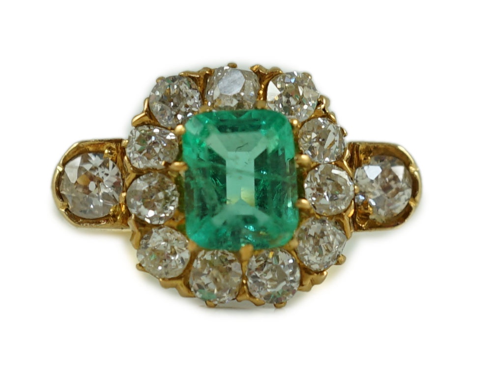 An 18ct gold, emerald and diamond octagonal cluster ring
